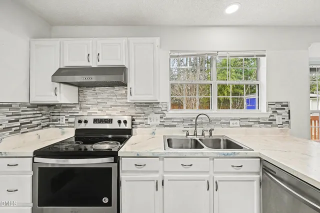 a backyard of a house with seating space