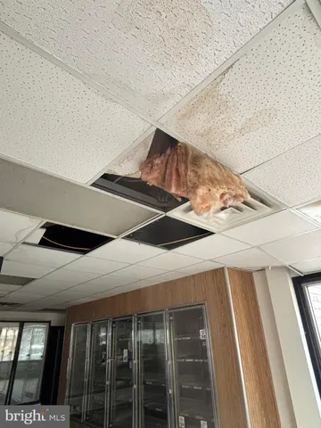 a kitchen with stainless steel appliances wooden cabinets a sink and a refrigerator