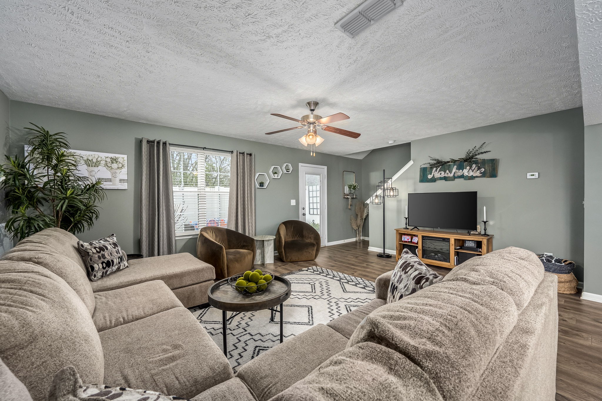 4720 Chelanie Circle Murfreesboro, TN 37129 - Photo 11 of 31 a living room with furniture and a flat screen tv