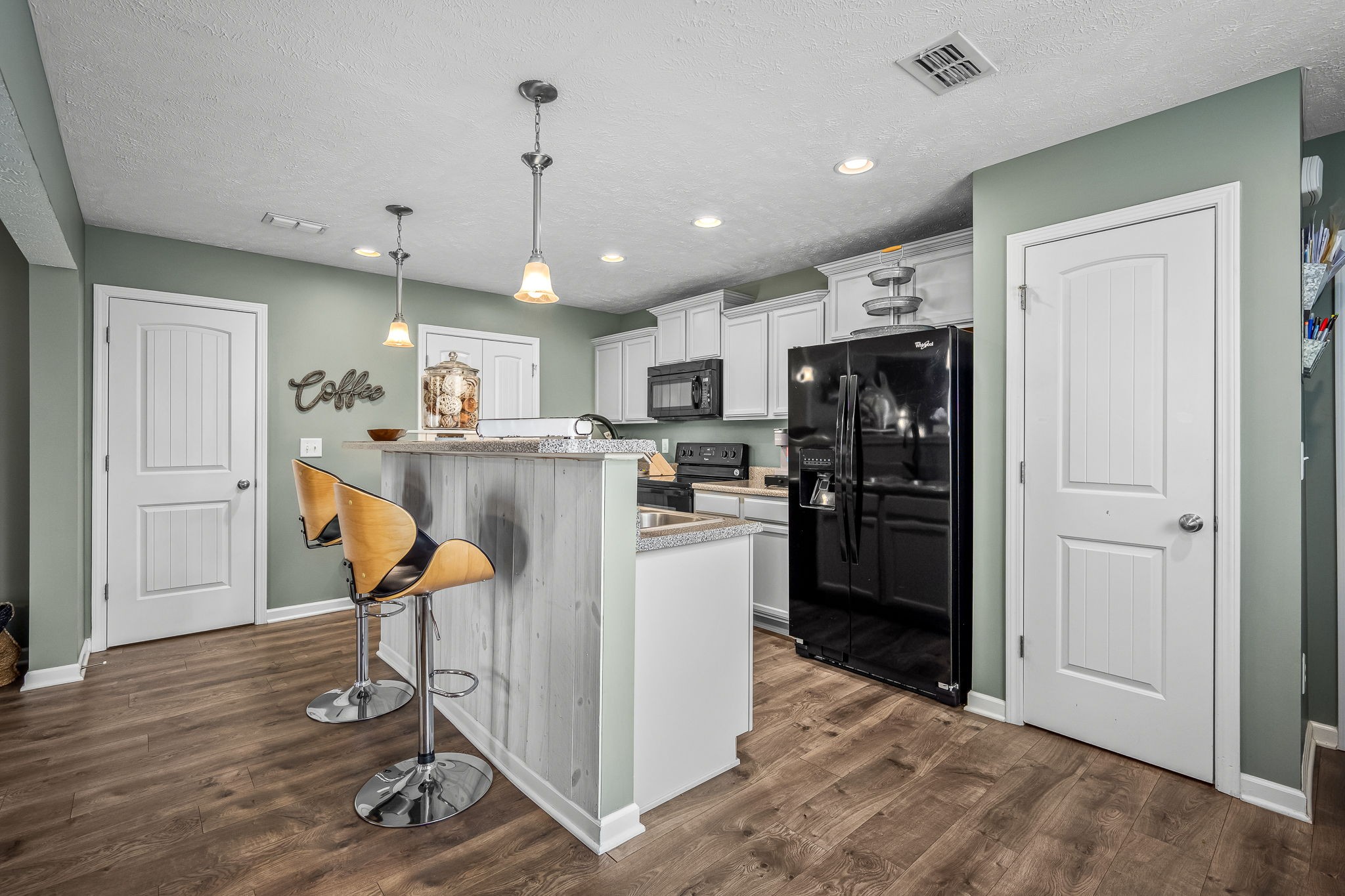 4720 Chelanie Circle Murfreesboro, TN 37129 - Photo 16 of 31 a kitchen with stainless steel appliances kitchen island hardwood floor and a refrigerator