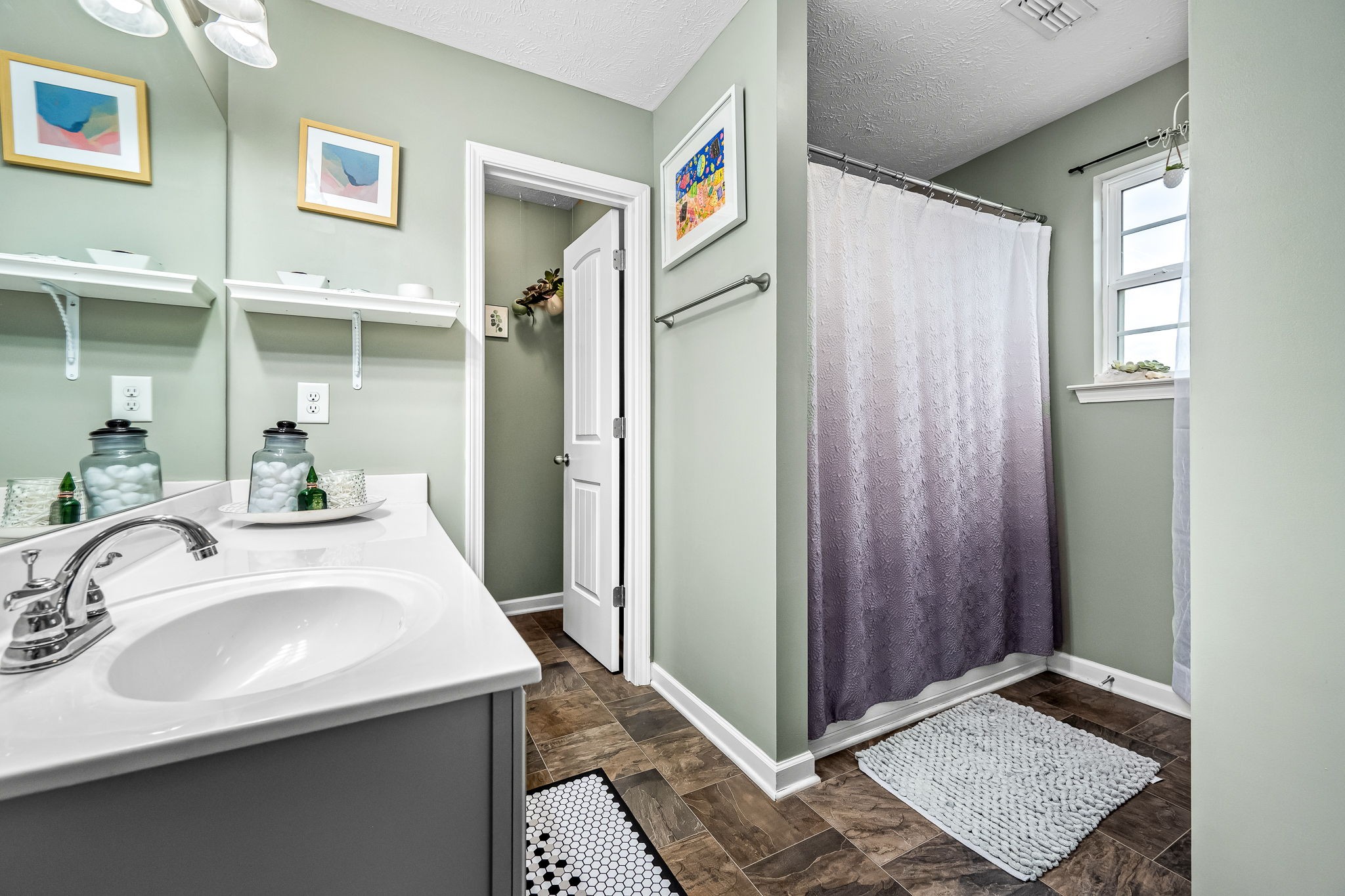 4720 Chelanie Circle Murfreesboro, TN 37129 - Photo 21 of 31 a bathroom with a sink and a mirror