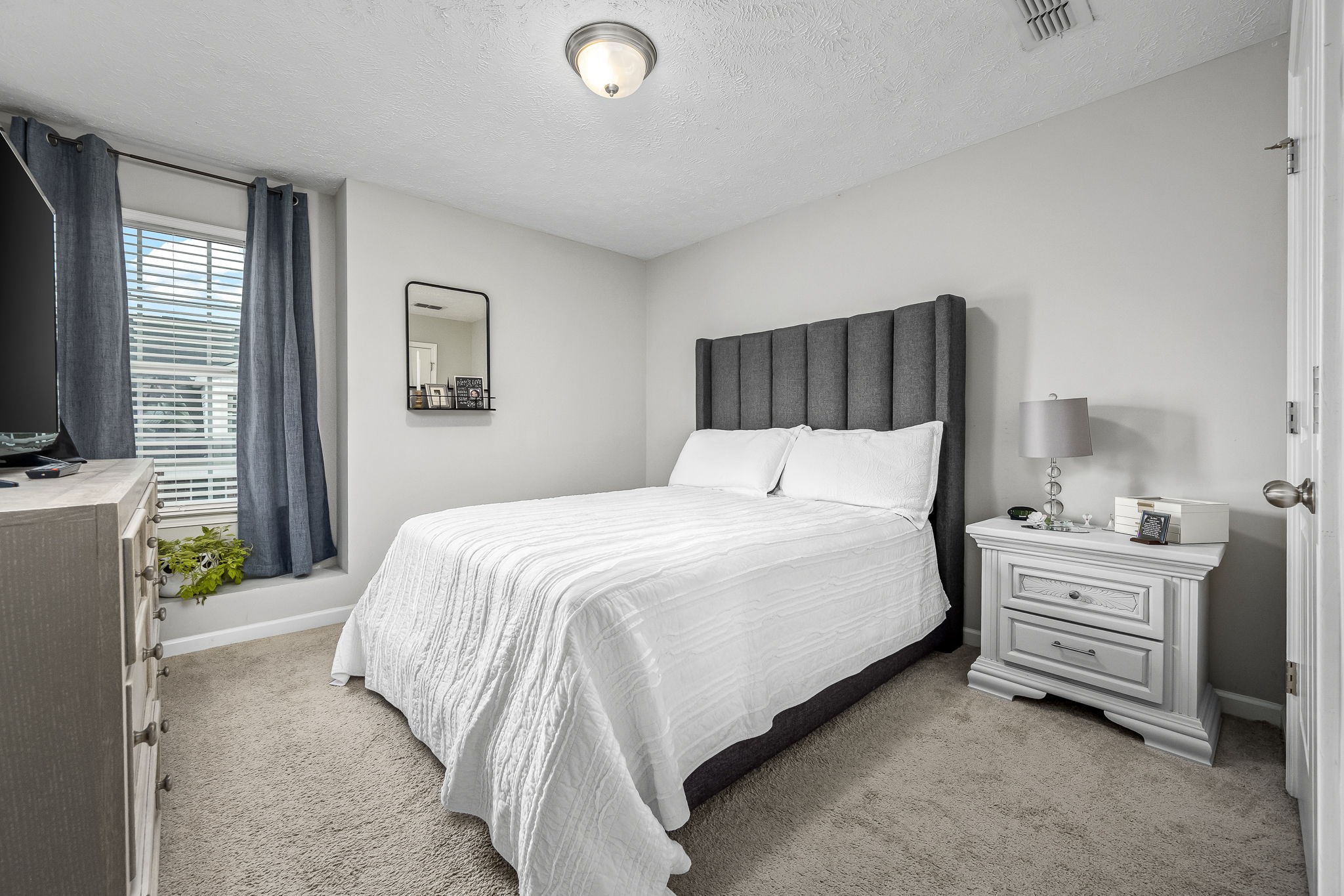 4720 Chelanie Circle Murfreesboro, TN 37129 - Photo 24 of 31 a bedroom with a bed and a flat screen tv