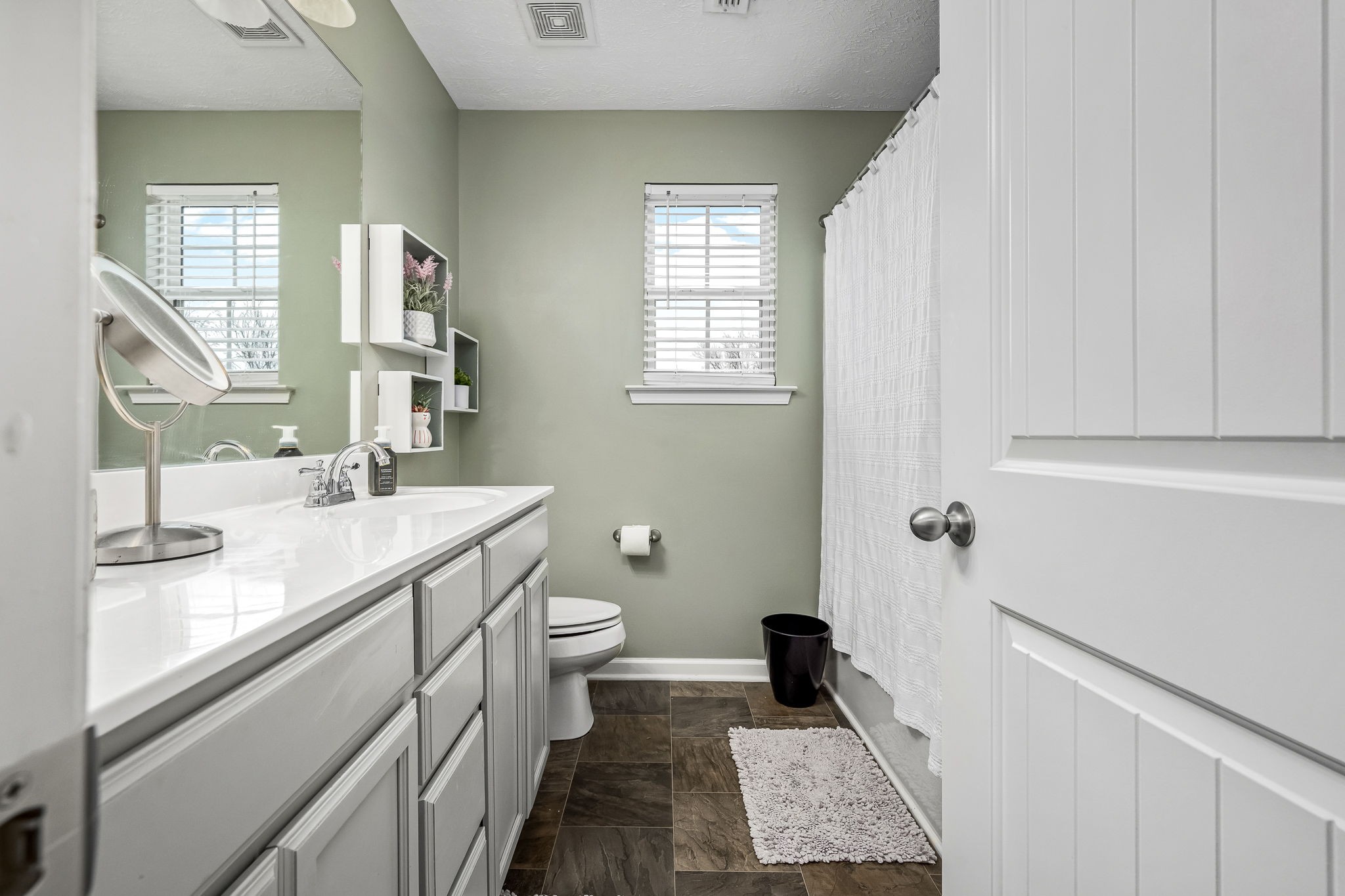 4720 Chelanie Circle Murfreesboro, TN 37129 - Photo 25 of 31 a bathroom with a sink a toilet and a mirror