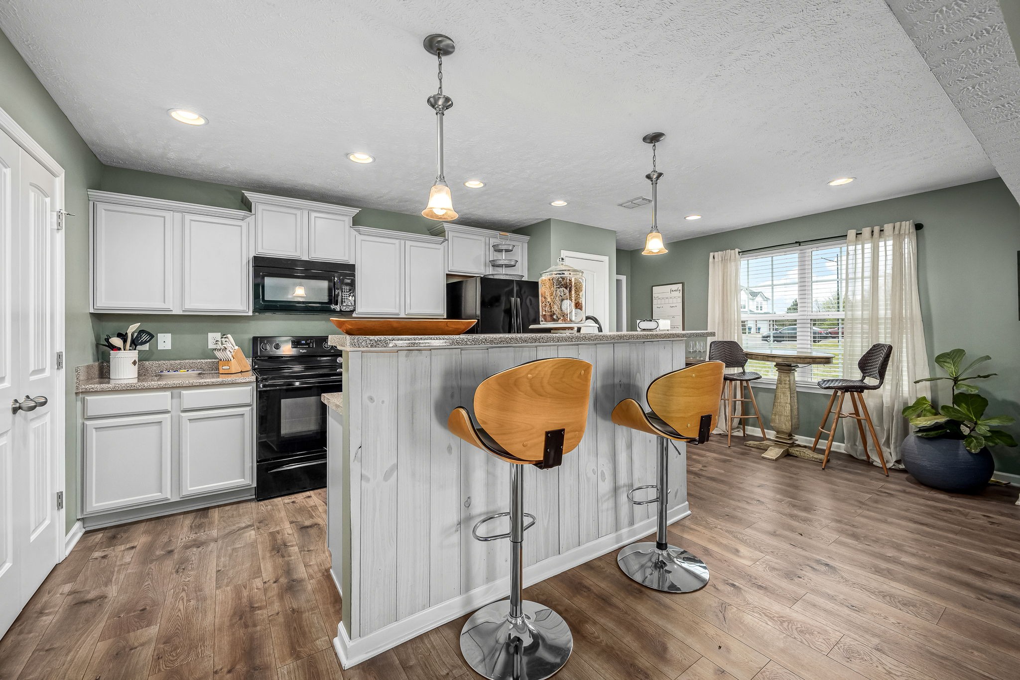 4720 Chelanie Circle Murfreesboro, TN 37129 - Photo 8 of 31 a large kitchen with lots of counter space dining table and stainless steel appliances