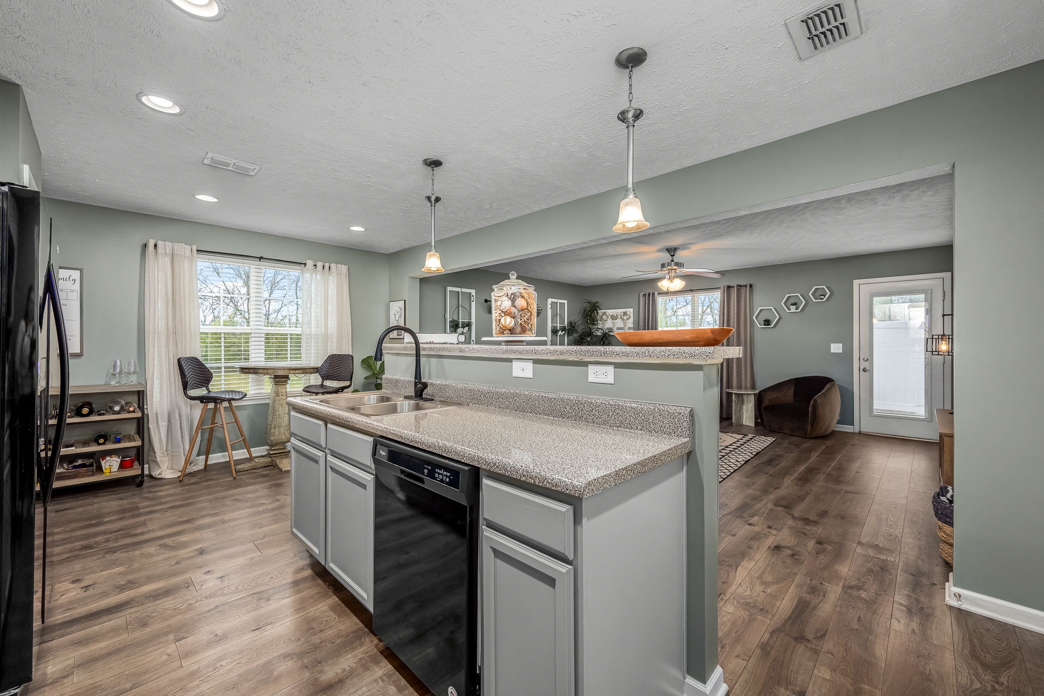 4720 Chelanie Circle Murfreesboro, TN 37129 - Photo 10 of 31 a kitchen with stainless steel appliances granite countertop a sink a stove and a wooden floors