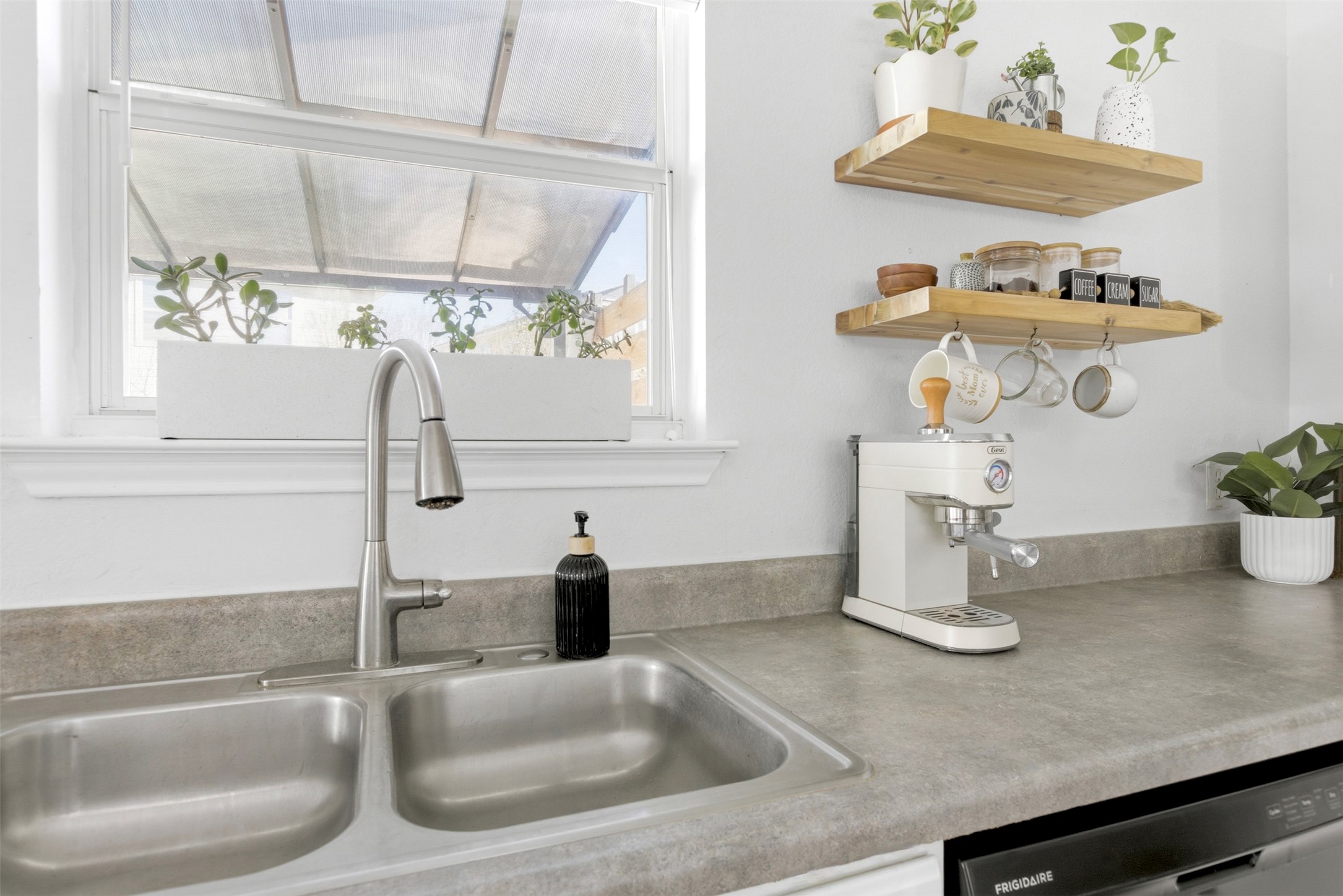 75 Jan Lane Georgetown, TX 78626 - Photo 14 of 32 Kitchen detail showcasing open shelving, stylish finishes, and functional counter space.