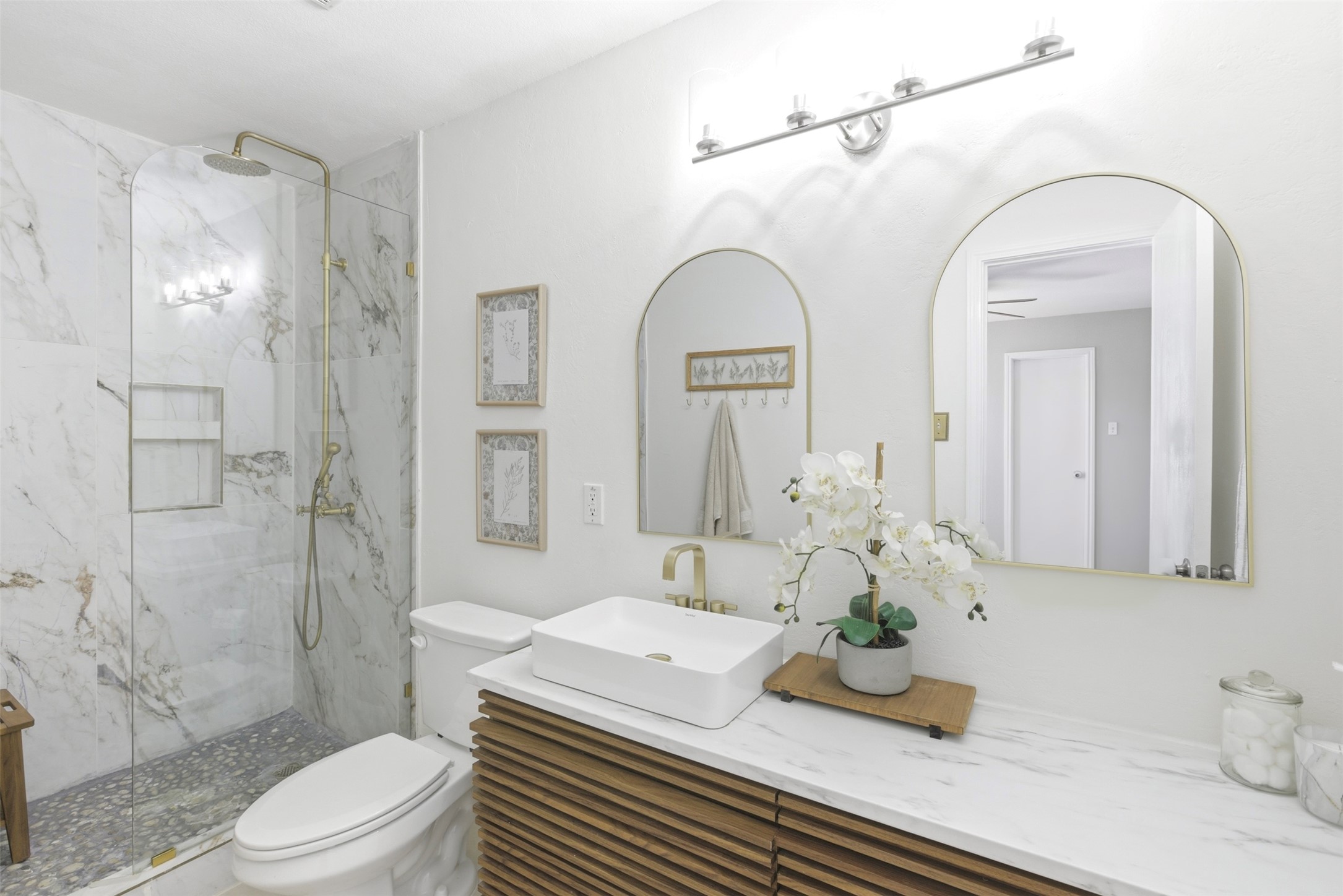 75 Jan Lane Georgetown, TX 78626 - Photo 19 of 32 Updated bathroom featuring mud set stone shower base, frameless shower glass, contemporary vanity and updated fixtures.