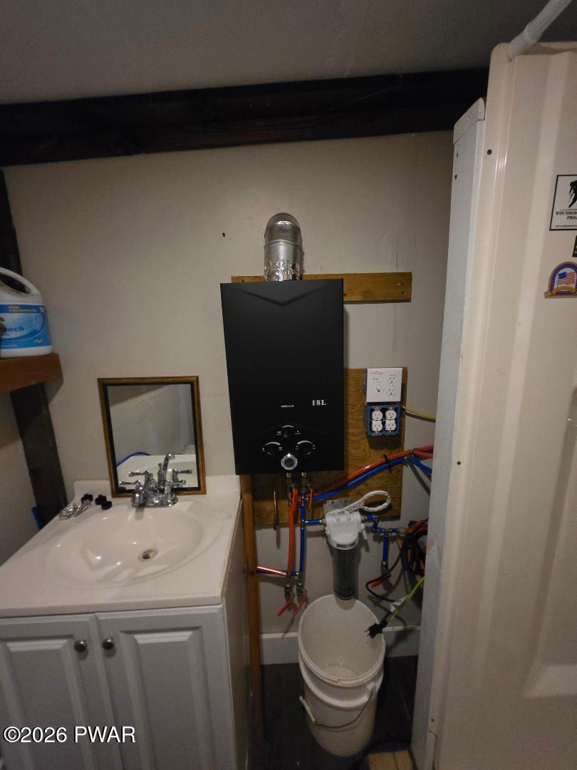94 Swamp Road Pleasant Mount, PA 18453 - Photo 12 of 33 a bathroom with a sink and a toilet