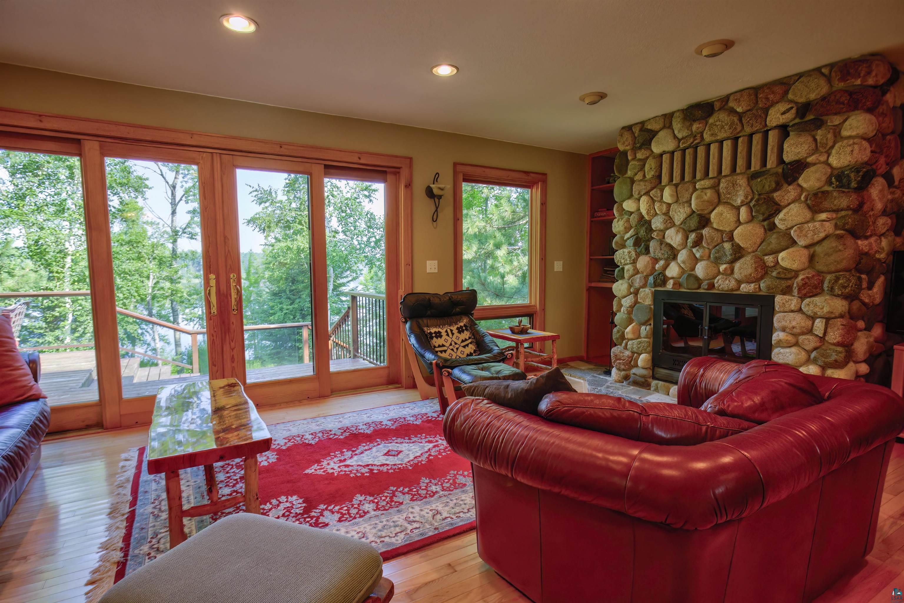 12351 Endless Waters Road Ely, MN 55731 - Photo 19 of 48 Living room with light wood-style floors, a fireplace, and recessed lighting