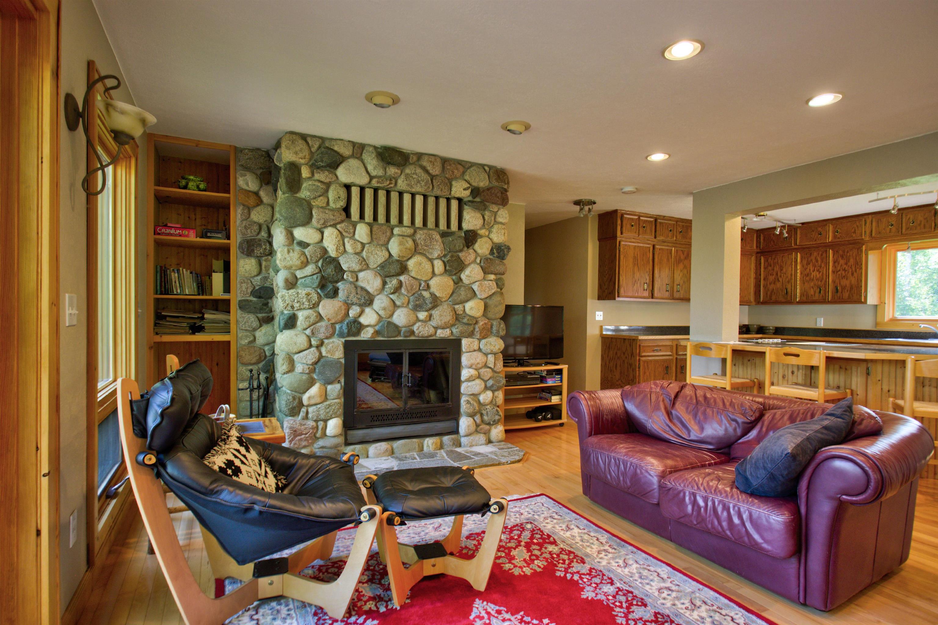 12351 Endless Waters Road Ely, MN 55731 - Photo 20 of 48 Living room with light wood-type flooring, a fireplace, built in shelves, and recessed lighting