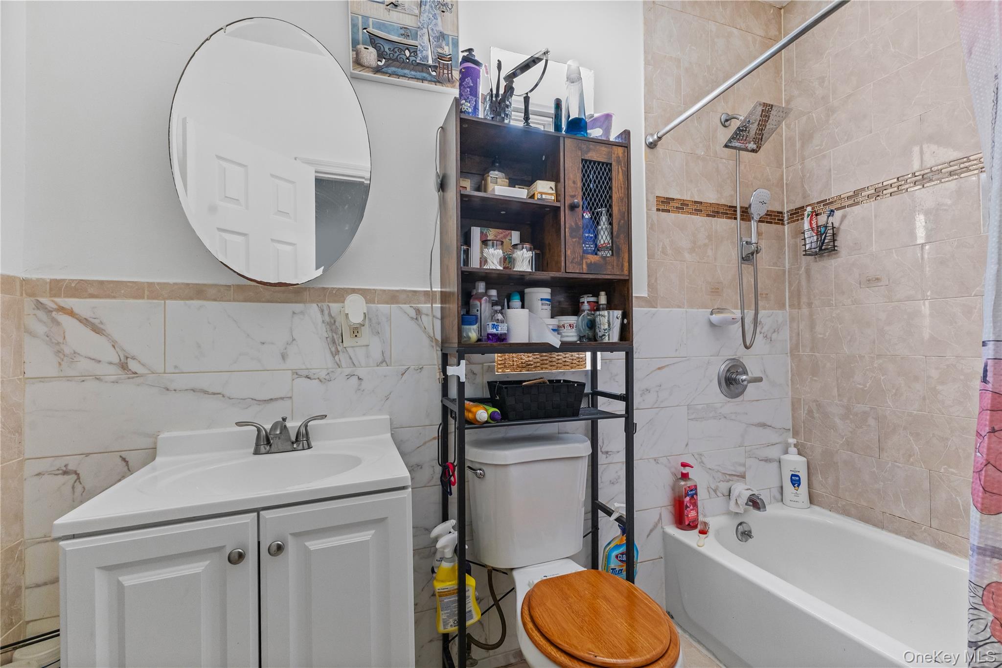 603 East 236th Street Bronx, NY 10466 - Photo 12 of 28 a bathroom with a sink toilet and shower