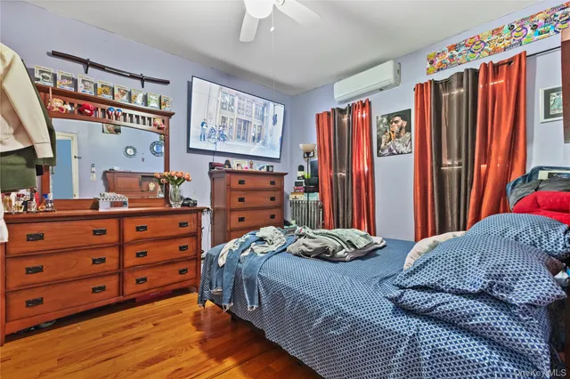 a bedroom with a bed and a bookshelf