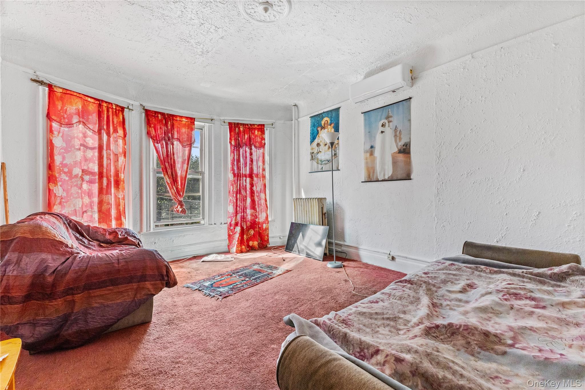 603 East 236th Street Bronx, NY 10466 - Photo 15 of 28 a bedroom with a bed and a window