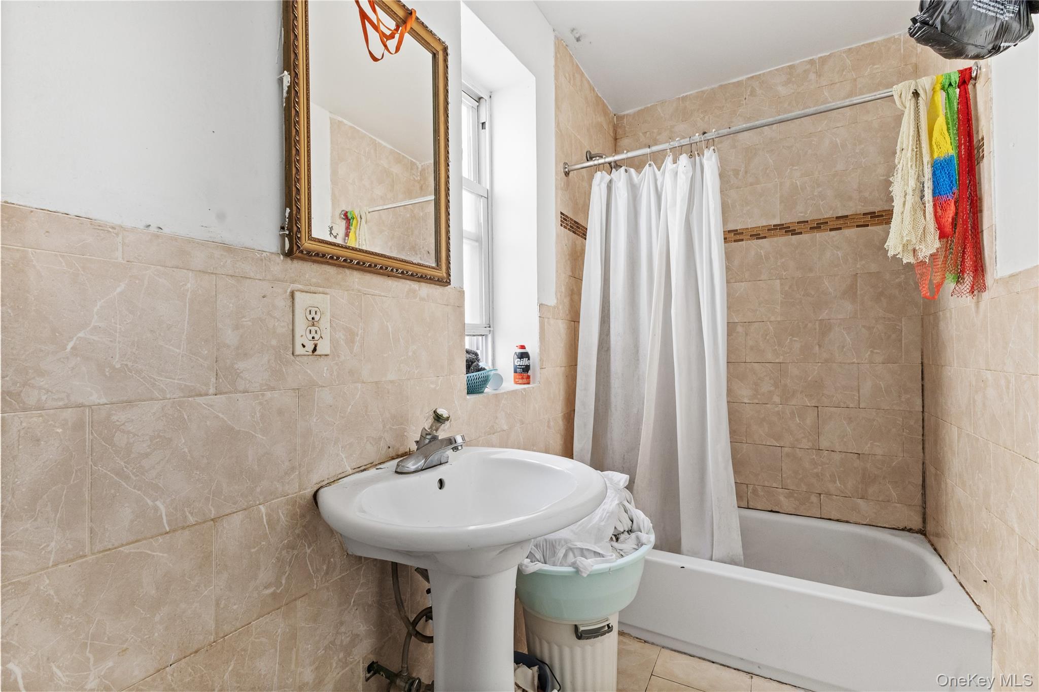 603 East 236th Street Bronx, NY 10466 - Photo 18 of 28 a bathroom with a sink and a bathtub