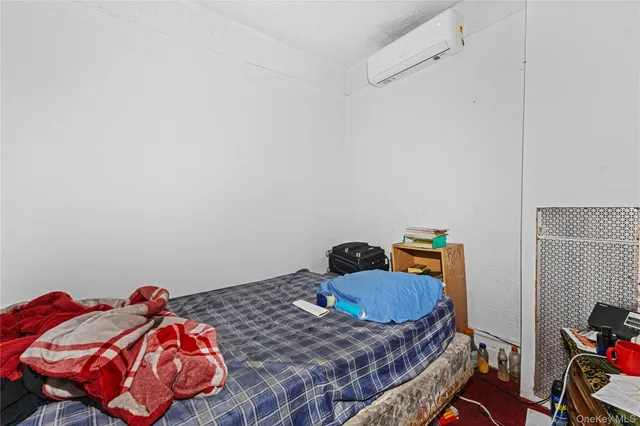 a bedroom with a bed and dresser