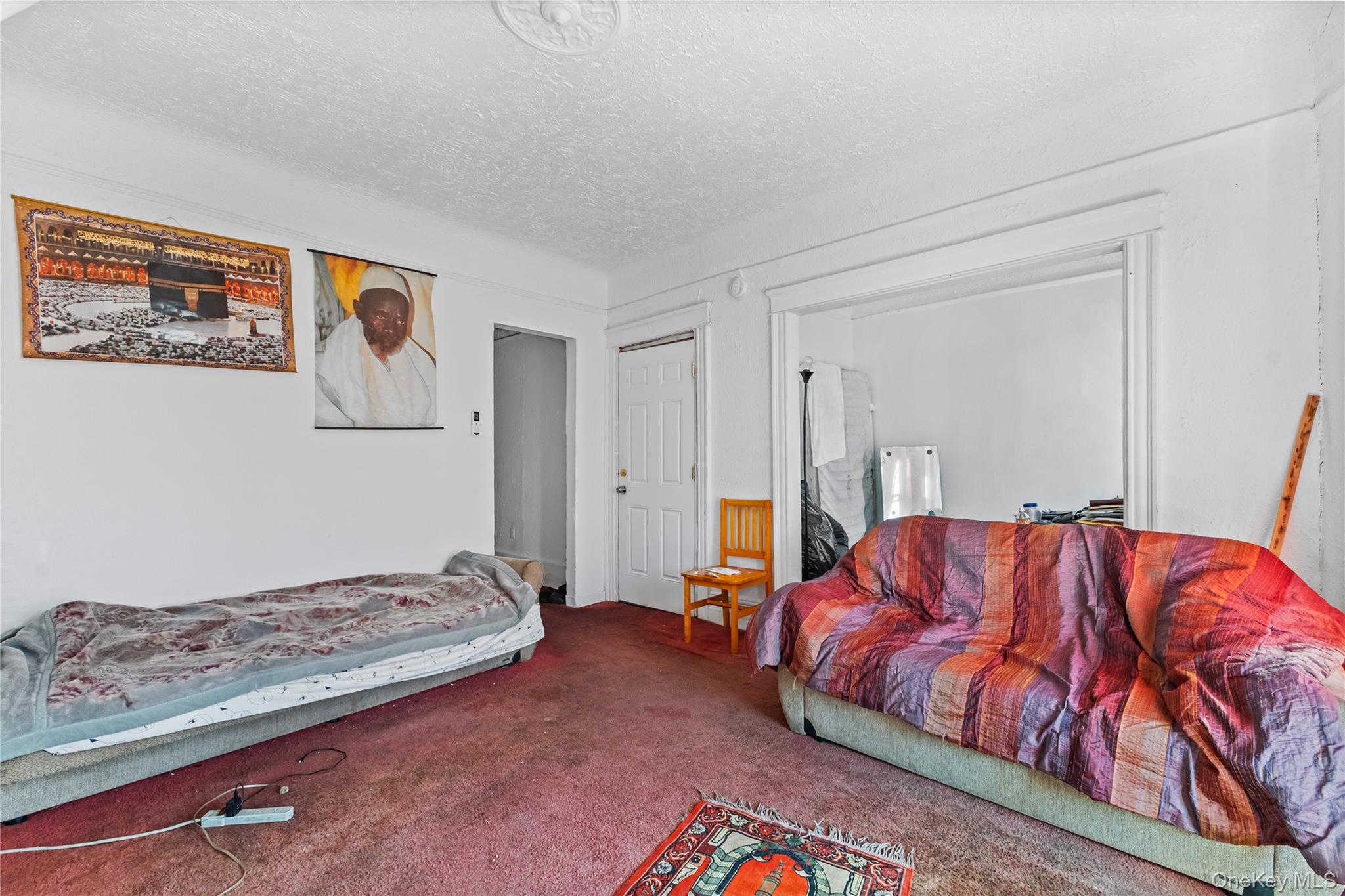 603 East 236th Street Bronx, NY 10466 - Photo 23 of 28 a bedroom with a bed and a couch