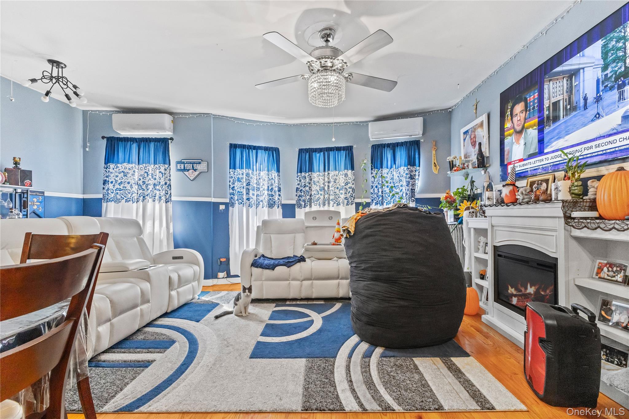 603 East 236th Street Bronx, NY 10466 - Photo 6 of 28 a living room with furniture and a fireplace
