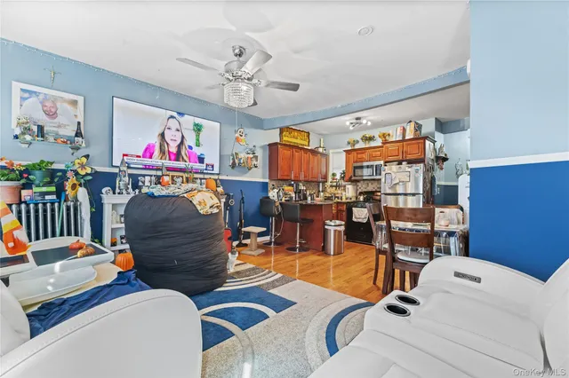 a living room filled with furniture and a chandelier
