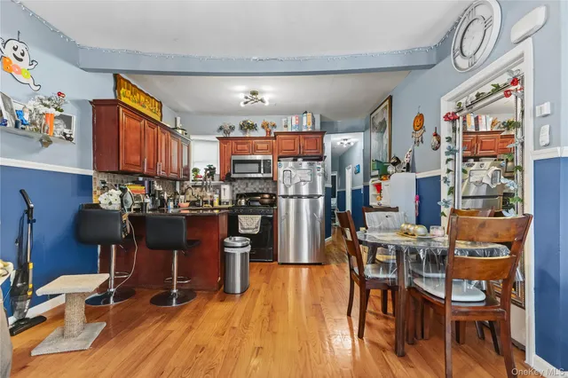 a outdoor dining space with chairs and wooden floor