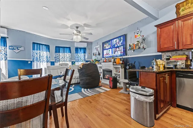 a view of a dining room with furniture a kitchen and chandelier