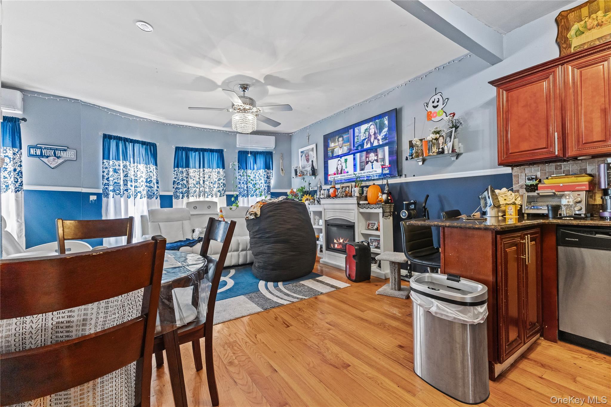 603 East 236th Street Bronx, NY 10466 - Photo 10 of 28 a view of a dining room with furniture a kitchen and chandelier