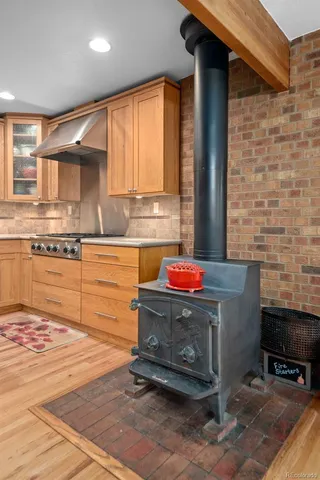 a view of a kitchen with stainless steel appliances and cabinets