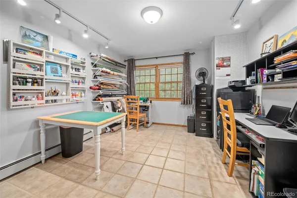 a view of a workspace with furniture