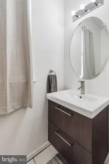 a bathroom with a sink and mirror
