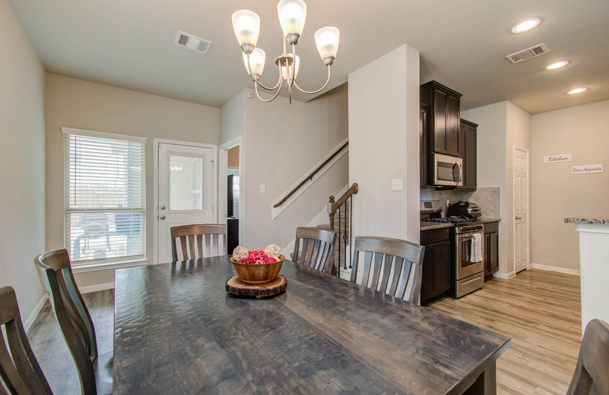 13309 Myrtle Meadows Lane Houston, TX 77048 - Photo 13 of 32 a living room with furniture and a flat screen tv