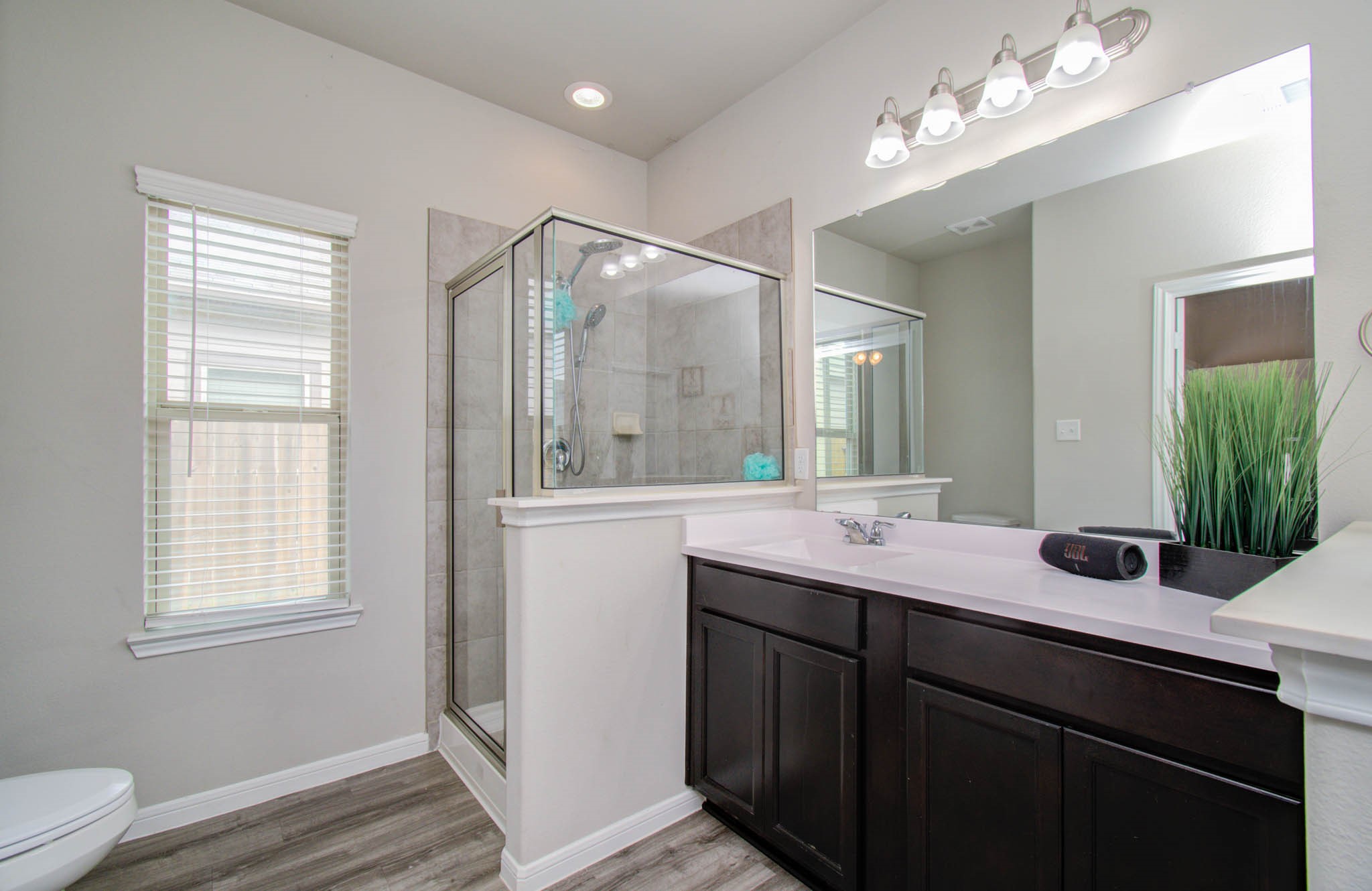 13309 Myrtle Meadows Lane Houston, TX 77048 - Photo 17 of 32 a bathroom with a sink double vanity and a mirror