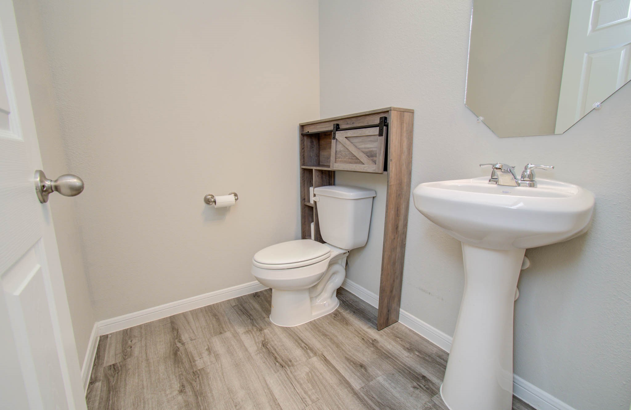 13309 Myrtle Meadows Lane Houston, TX 77048 - Photo 20 of 32 a bathroom with a sink toilet and a mirror