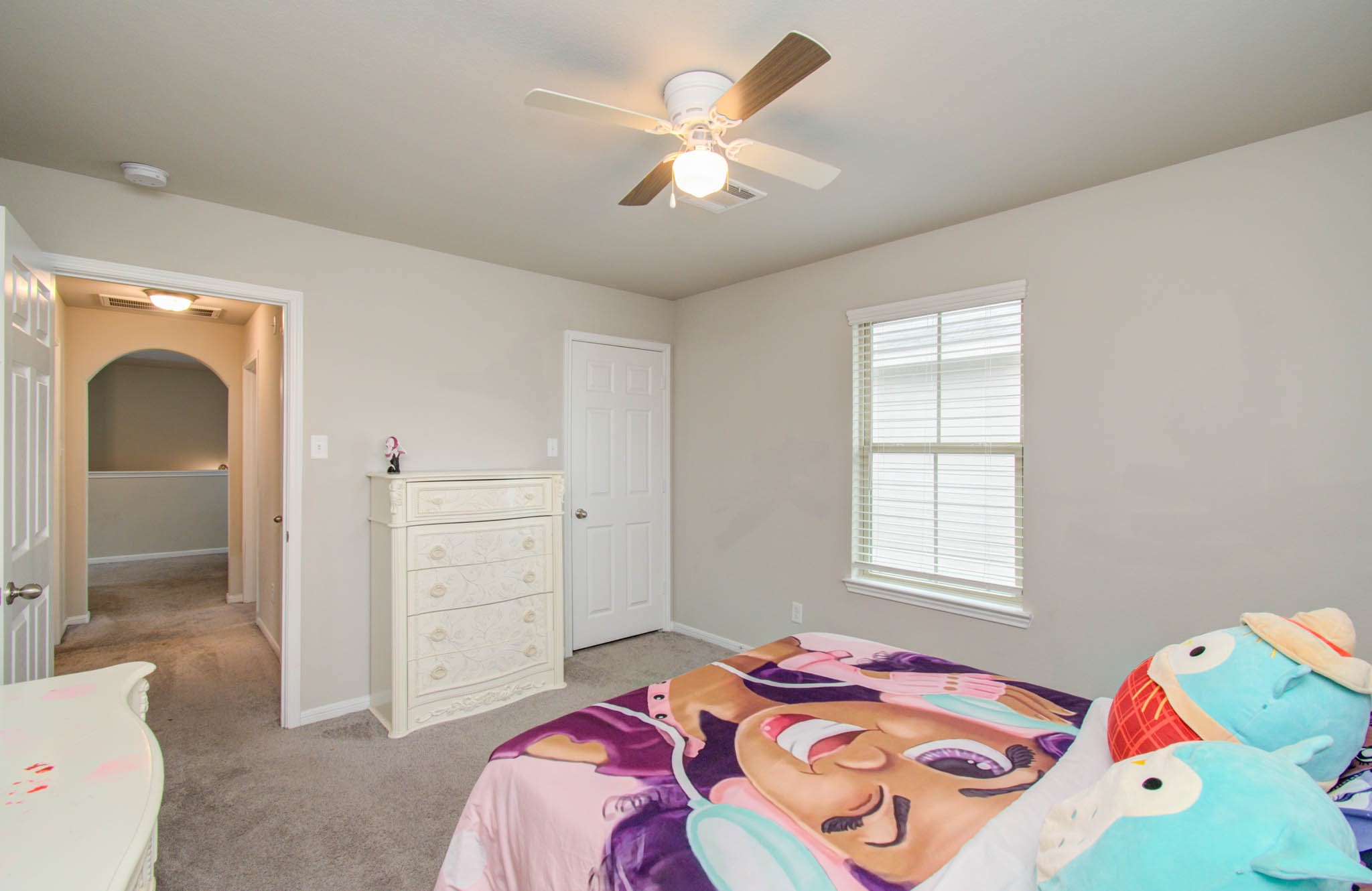 13309 Myrtle Meadows Lane Houston, TX 77048 - Photo 29 of 32 a bedroom with a bed and a window