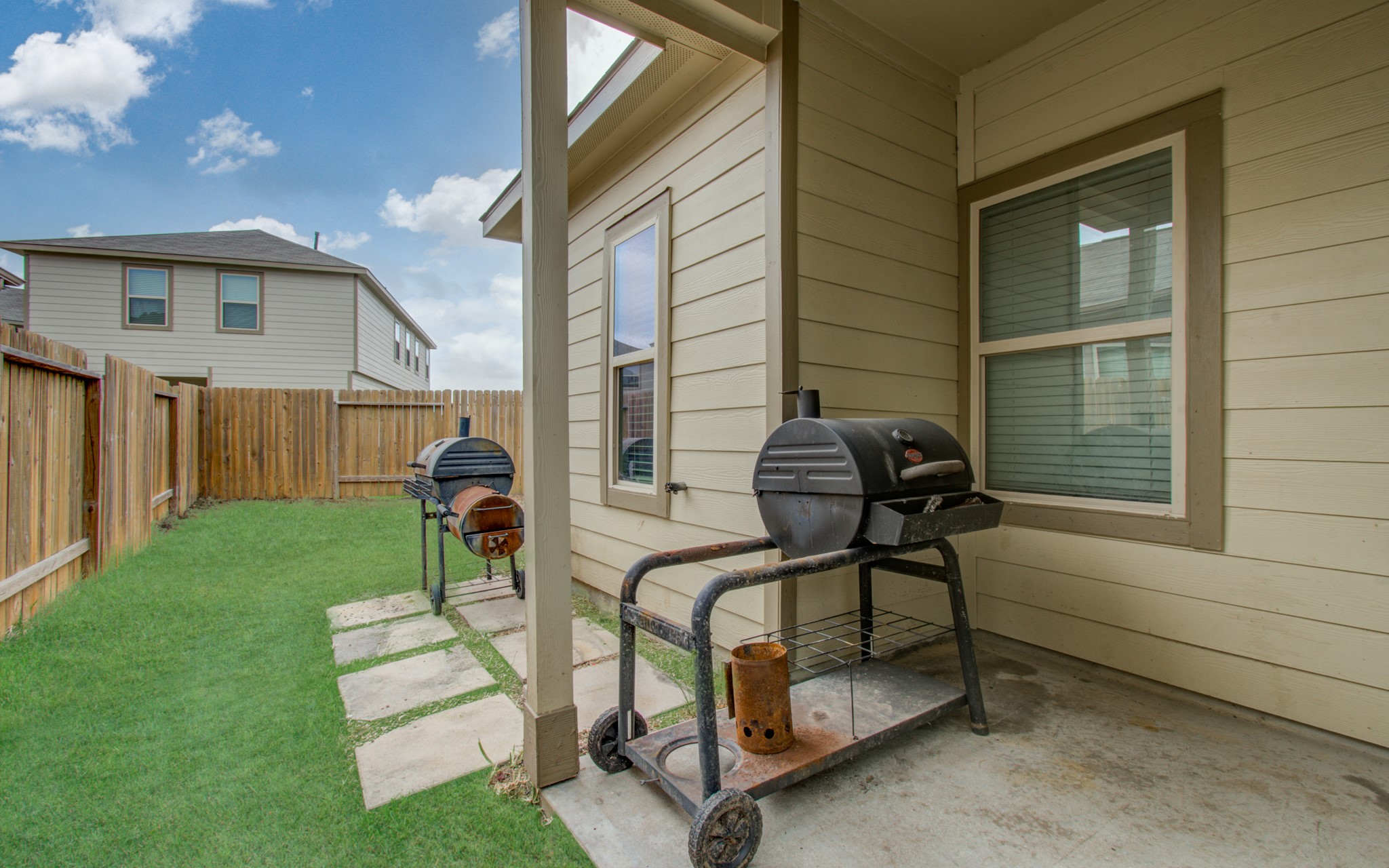 13309 Myrtle Meadows Lane Houston, TX 77048 - Photo 30 of 32 a view of backyard with a patio and a garden