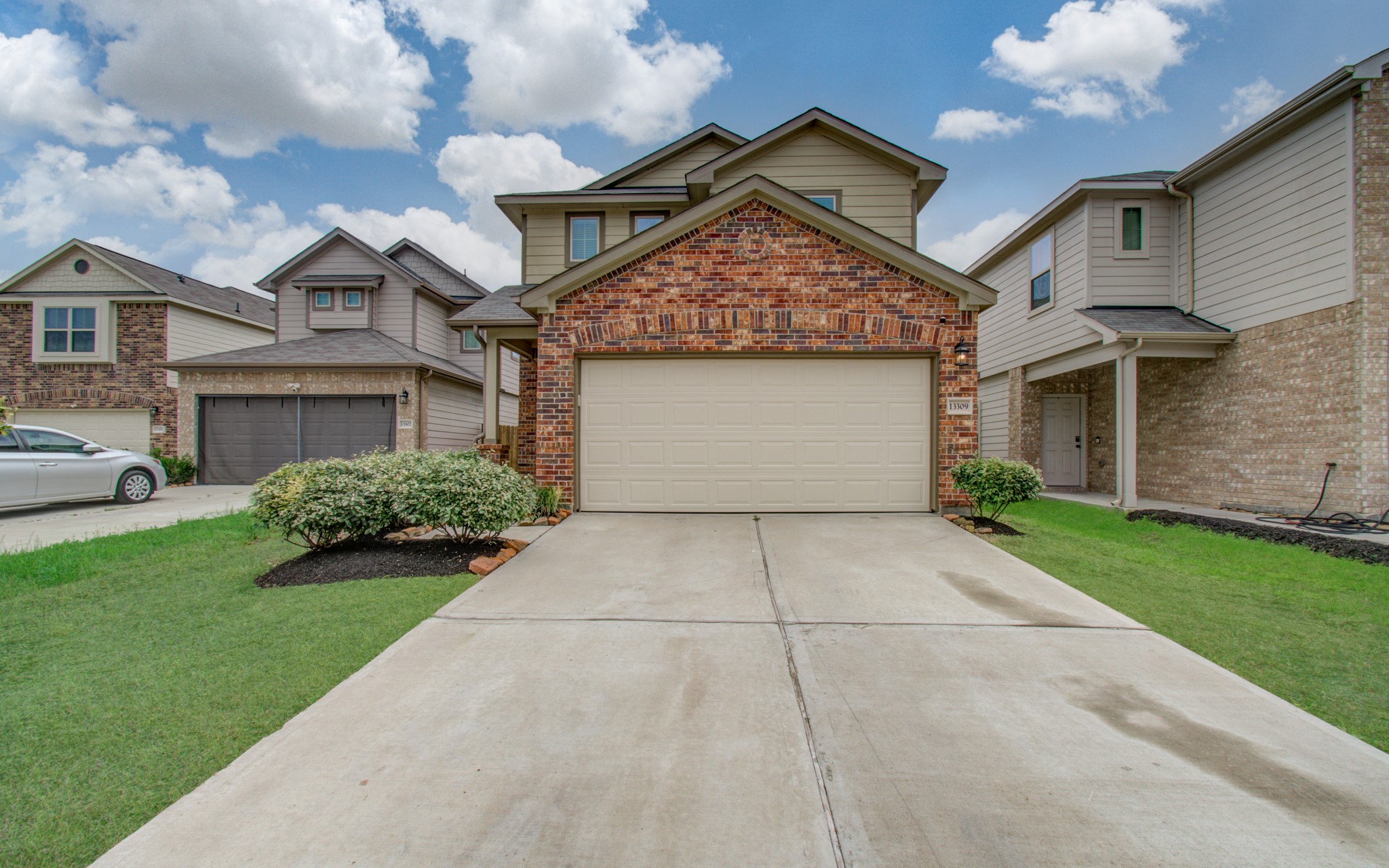 13309 Myrtle Meadows Lane Houston, TX 77048 - Photo 3 of 32 a front view of a house with garden