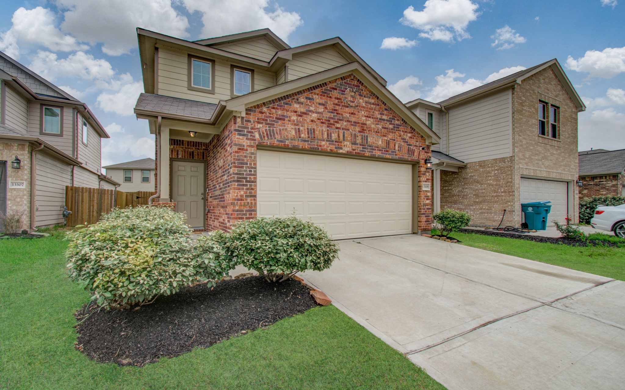 13309 Myrtle Meadows Lane Houston, TX 77048 - Photo 4 of 32 a front view of a house with garden