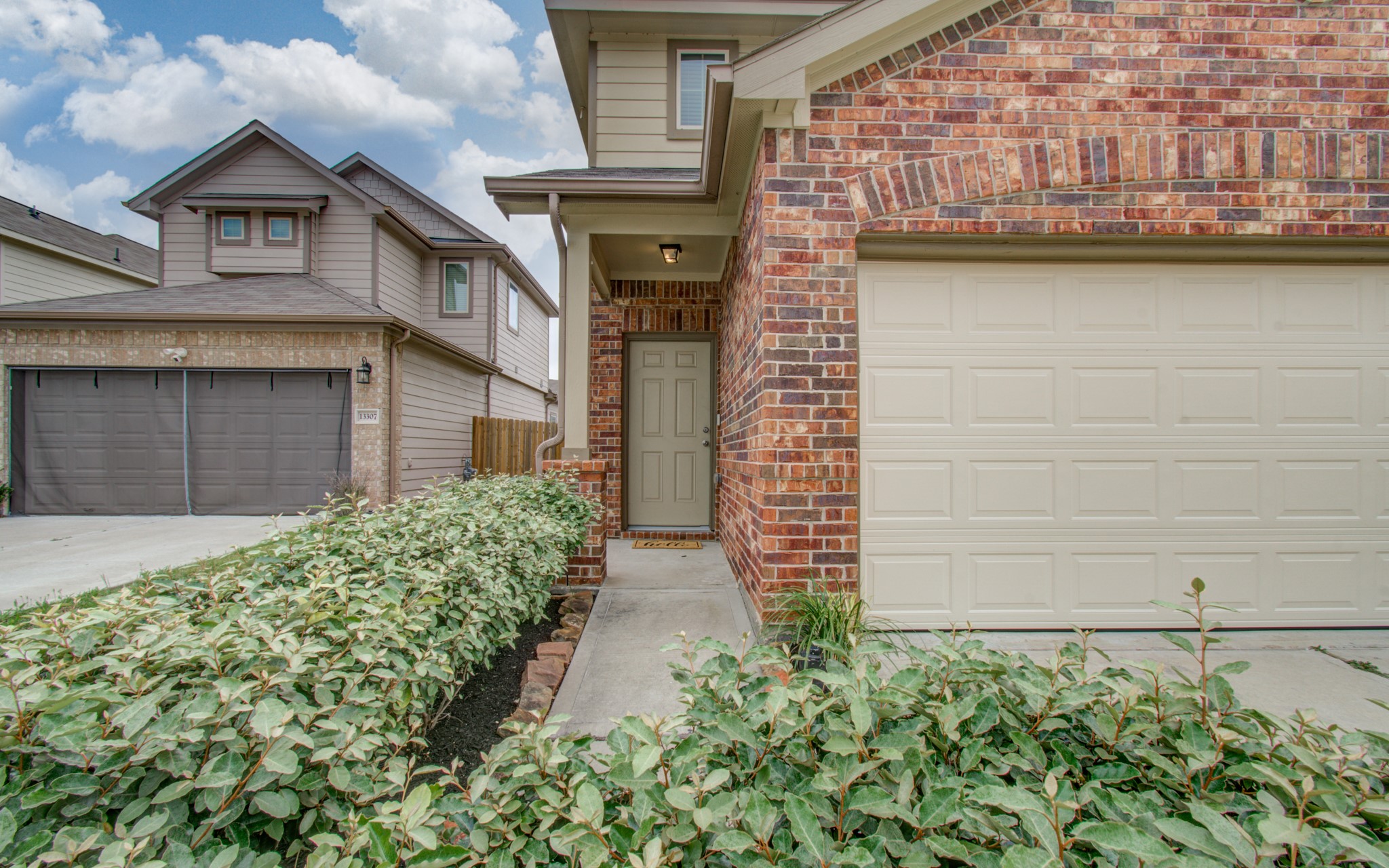 13309 Myrtle Meadows Lane Houston, TX 77048 - Photo 5 of 32 a front view of a house with garden