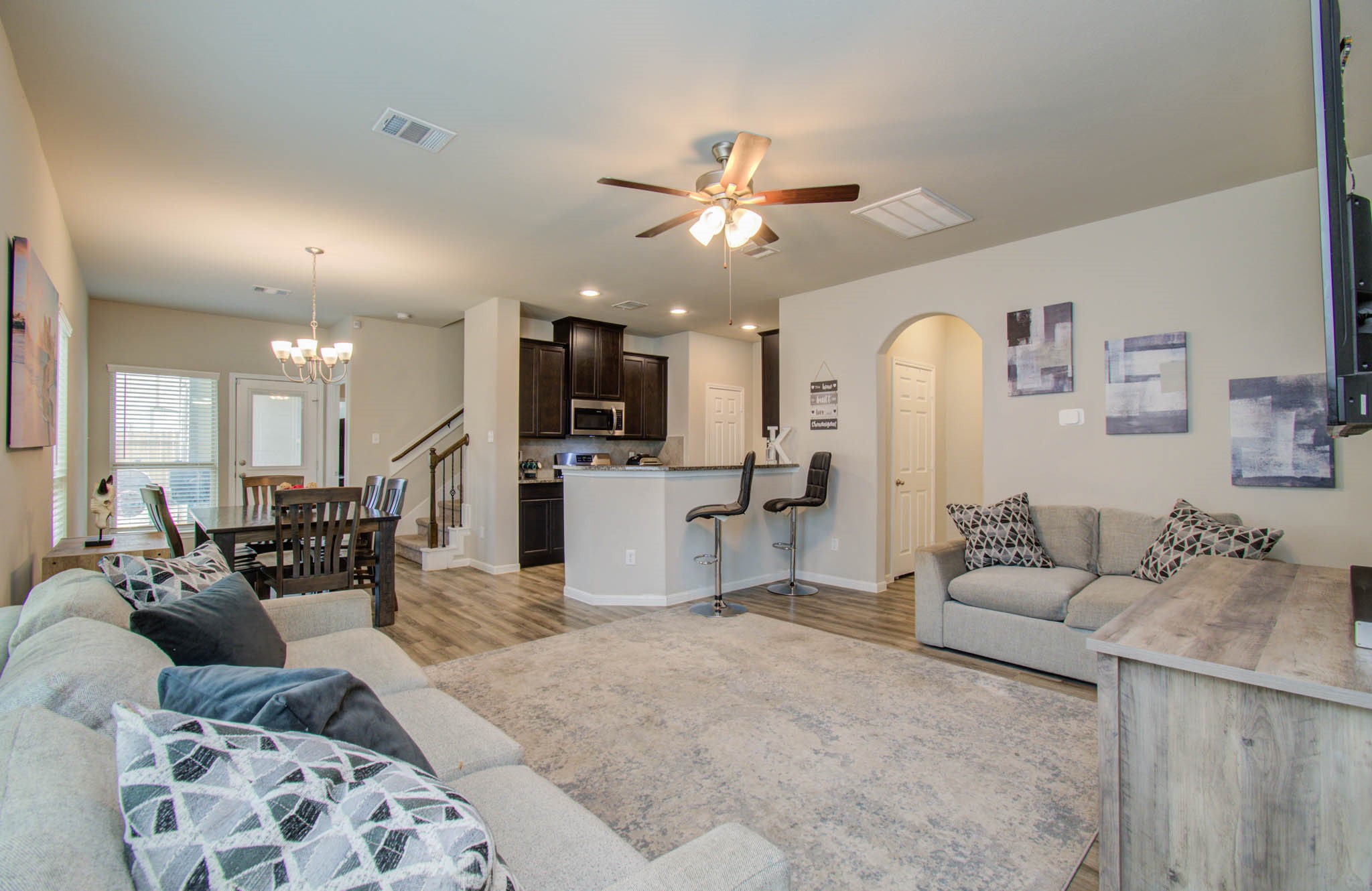 13309 Myrtle Meadows Lane Houston, TX 77048 - Photo 6 of 32 a living room with furniture and kitchen view