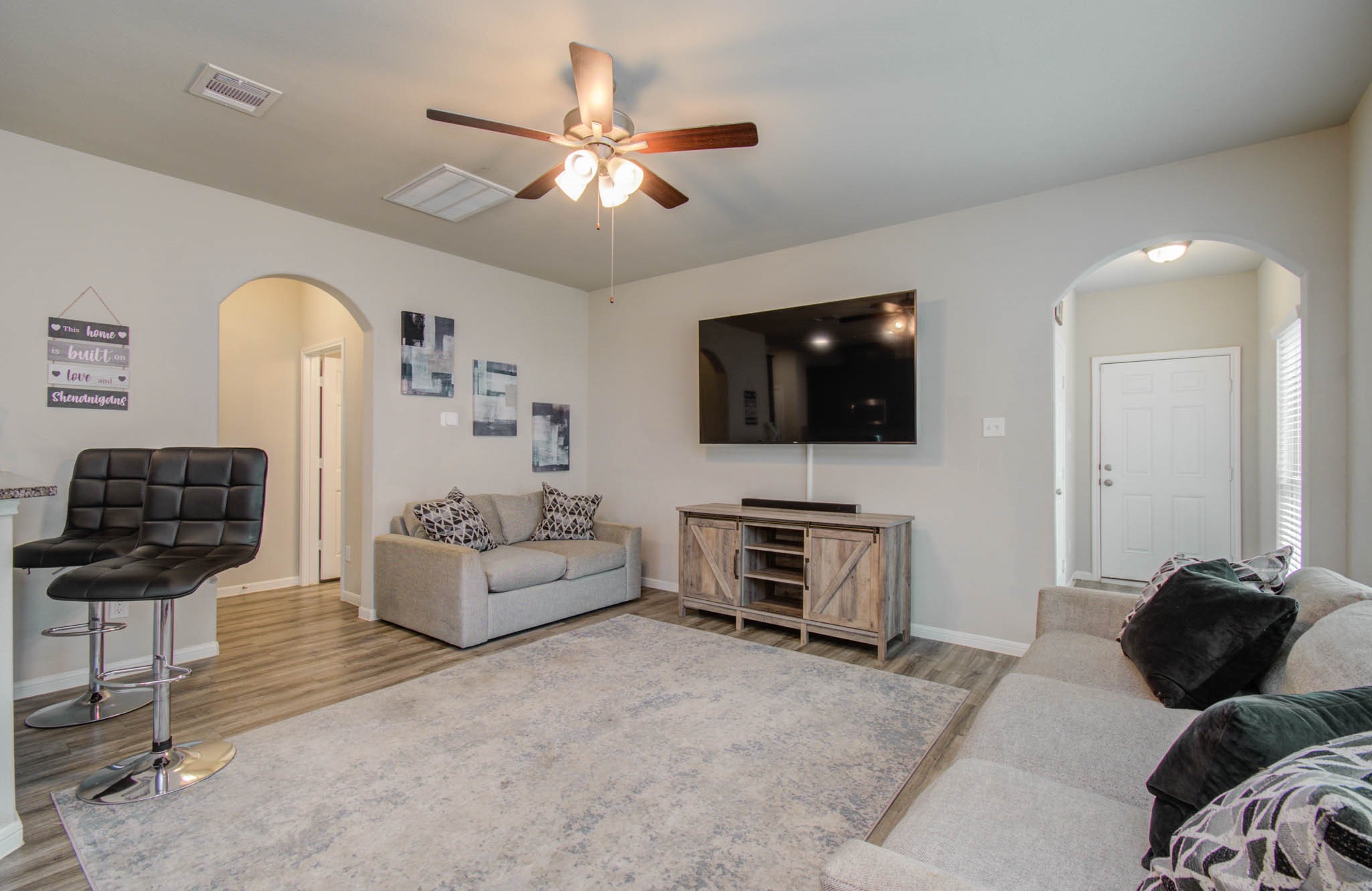 13309 Myrtle Meadows Lane Houston, TX 77048 - Photo 7 of 32 a living room with furniture and a flat screen tv