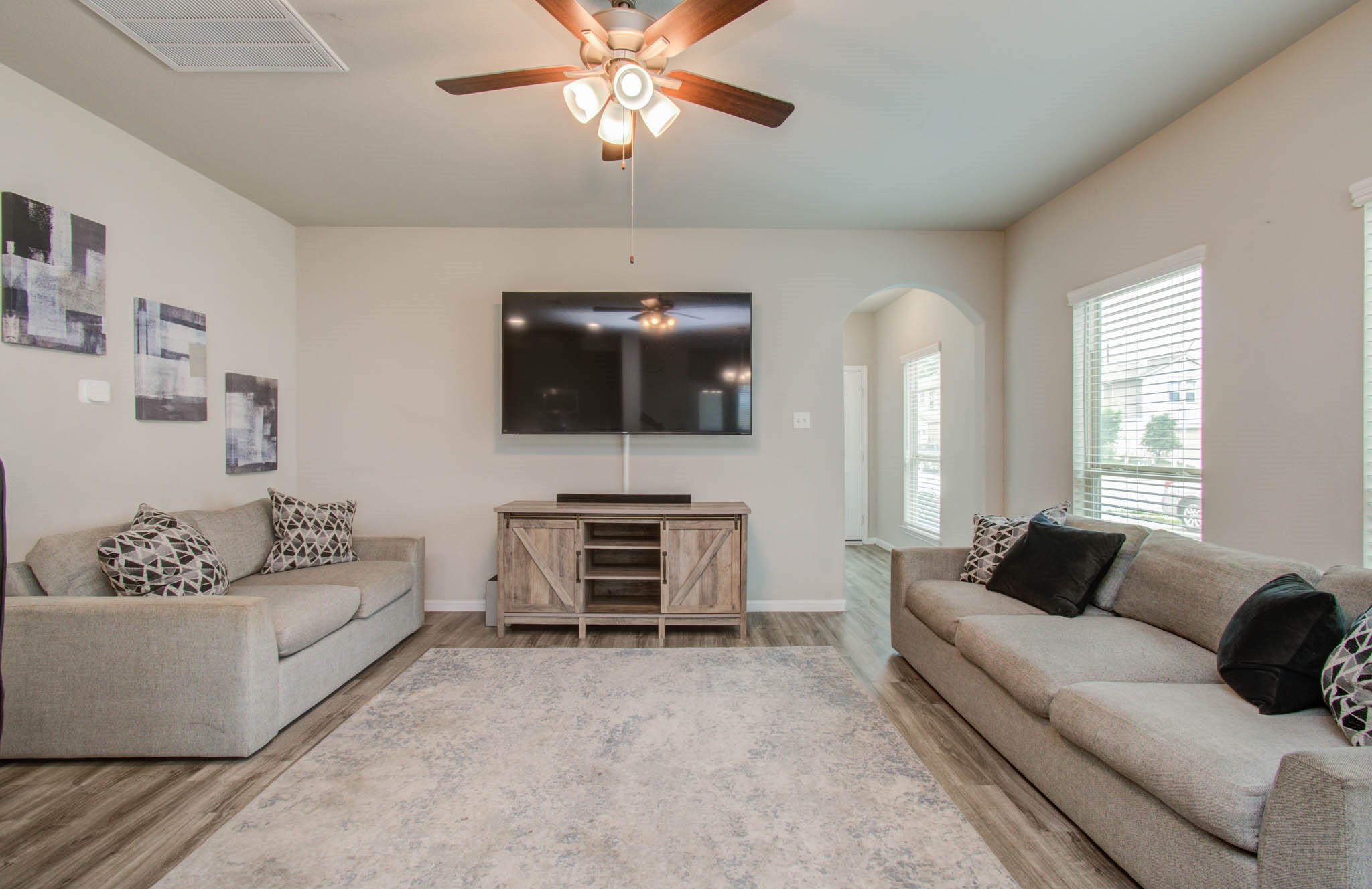 13309 Myrtle Meadows Lane Houston, TX 77048 - Photo 8 of 32 a living room with furniture and a flat screen tv