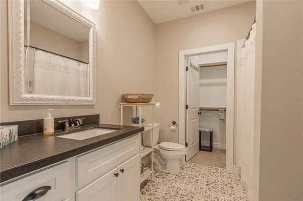 a bathroom with a shower and a toilet