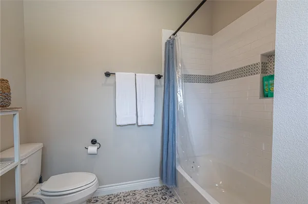 a bedroom with bed and window