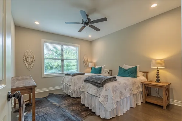 a hall with a sink cabinets and a window