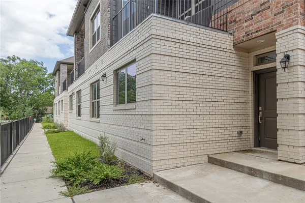 a view of a balcony with furniture