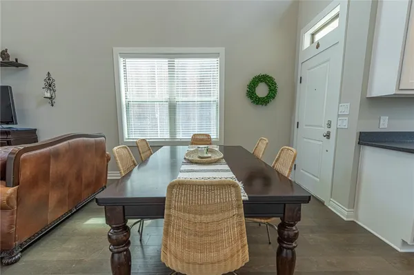 a view of a dining room with furniture and window