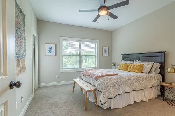 a bedroom with a bed and window