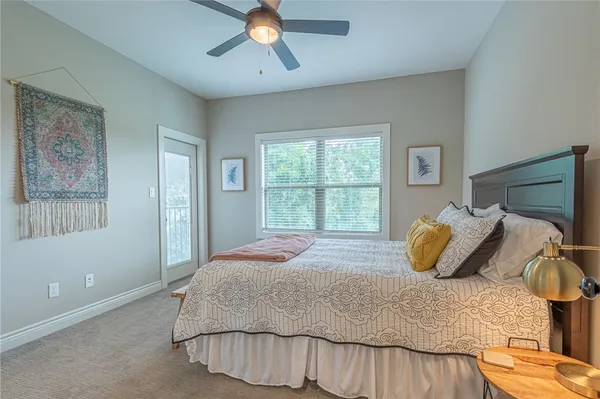 a bedroom with a bed and window