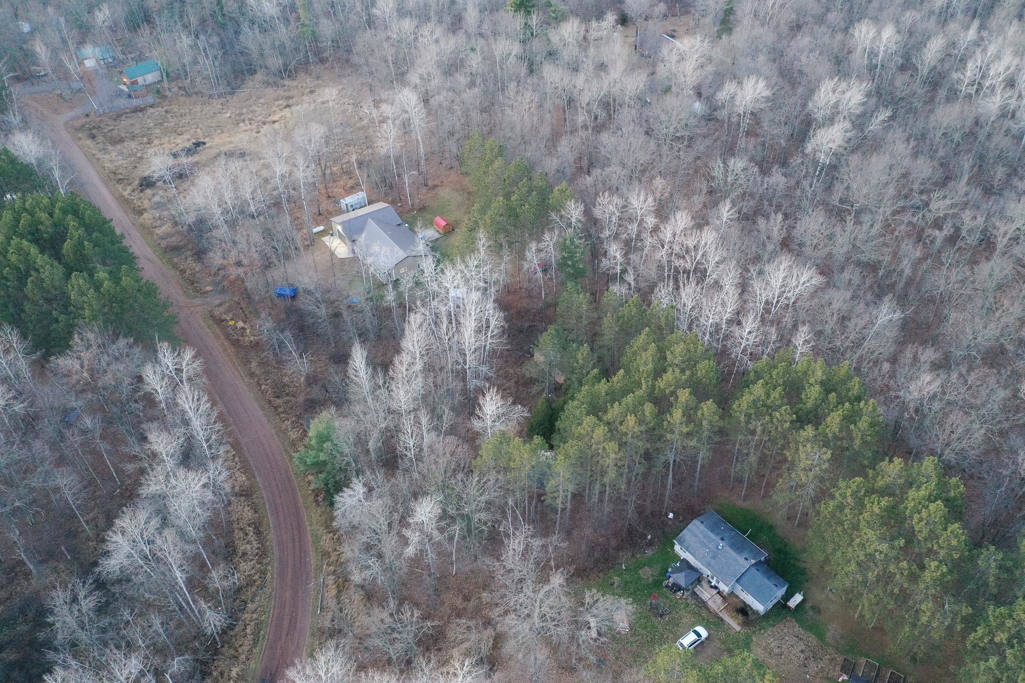 87927 Alder Loop Sturgeon Lake, MN 55783 - Photo 2 of 20 Aerial view of property and surrounding area with a heavily wooded area