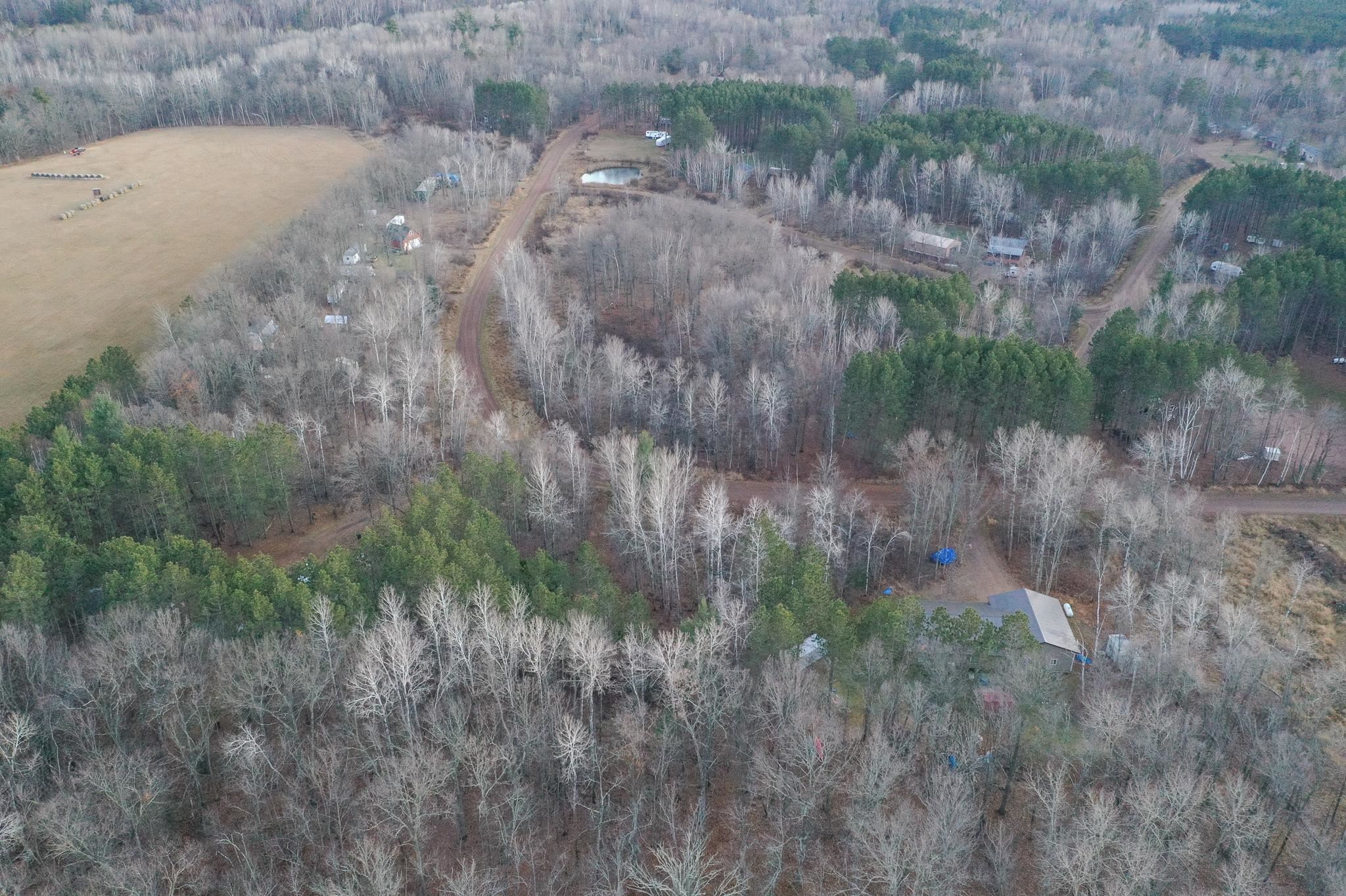 87927 Alder Loop Sturgeon Lake, MN 55783 - Photo 6 of 20 Aerial view of property's location with a heavily wooded area