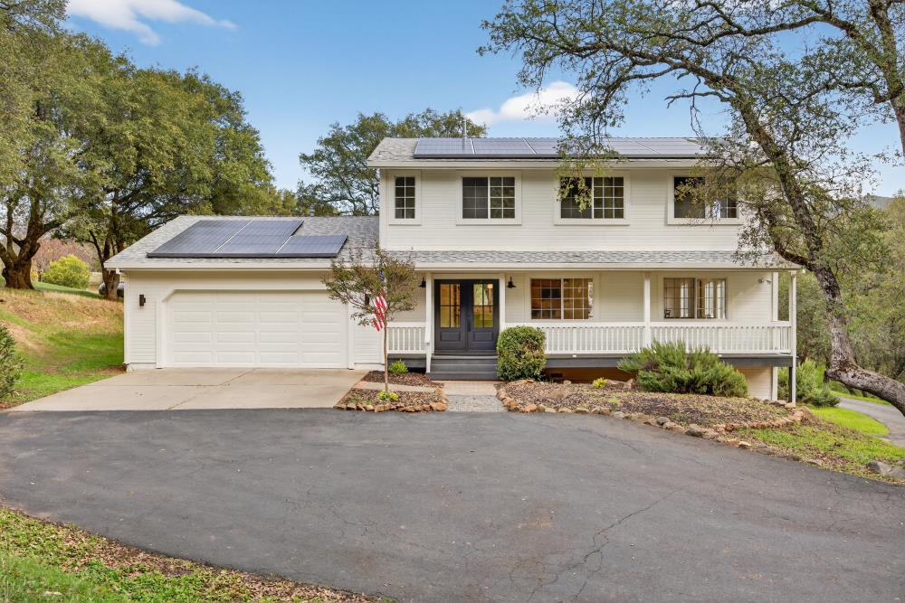3630 Four Springs Drive Rescue, CA 95672 - Photo 1 of 1 a front view of a house with a yard and garage