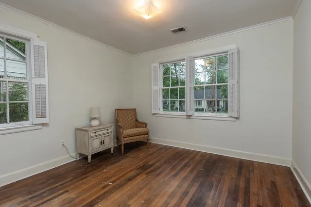 a living room with furniture and windows